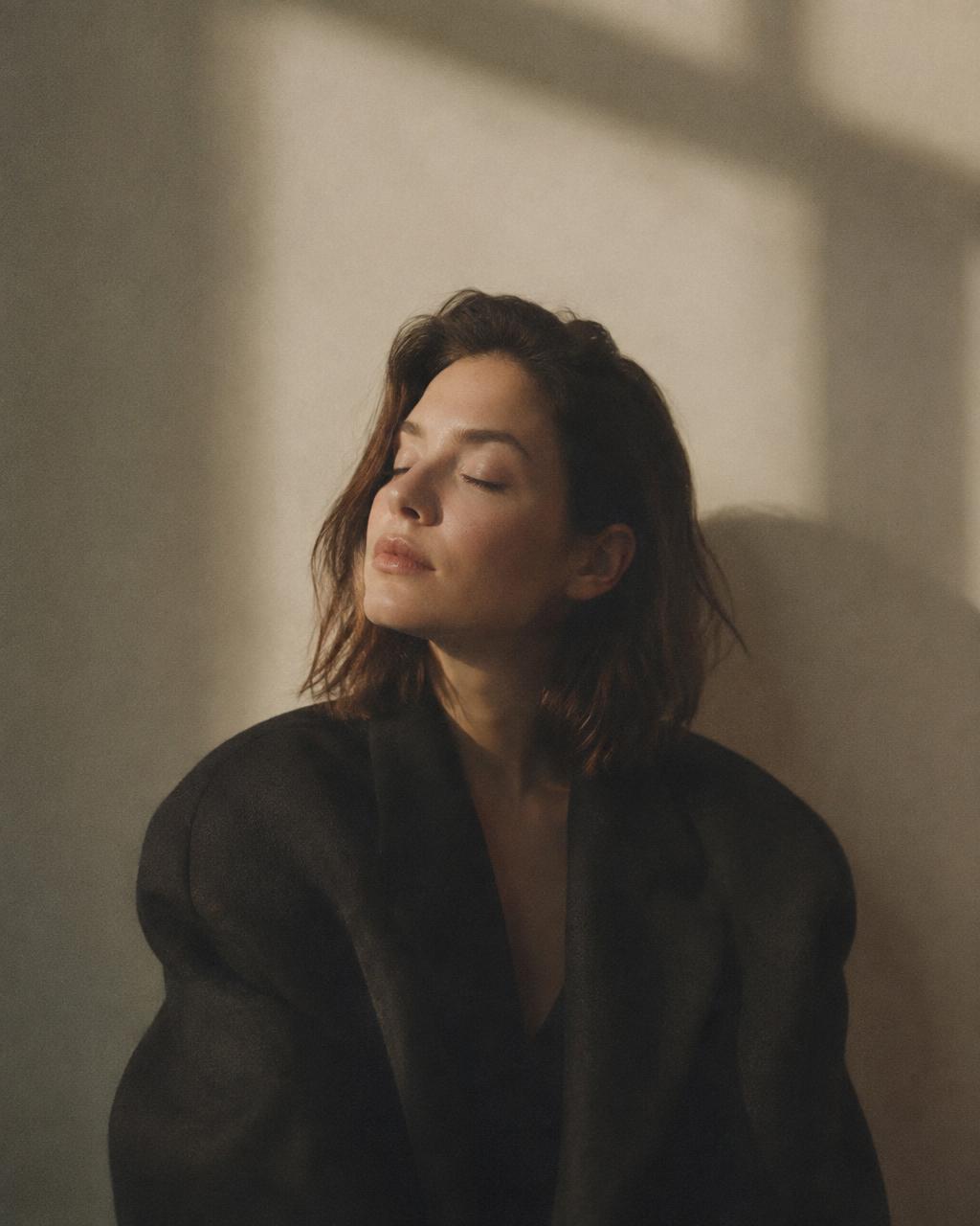 Portrait of a person resting with eyes closed in soft light